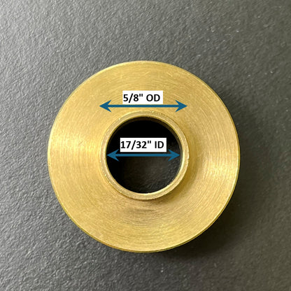 Gold metal bushing with labeled dimensions on a gray background