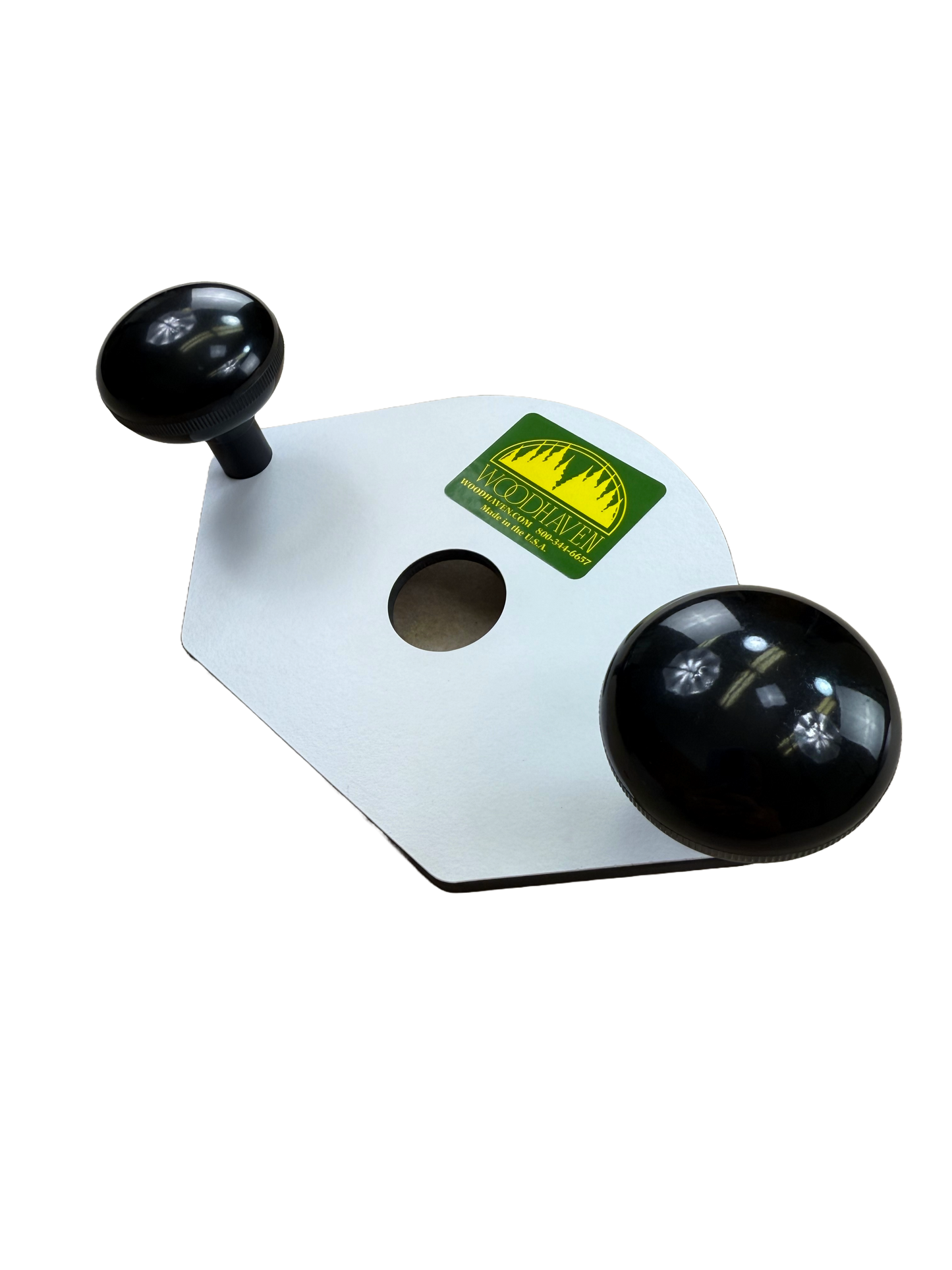 White phenolic base with black knobs and a green label  