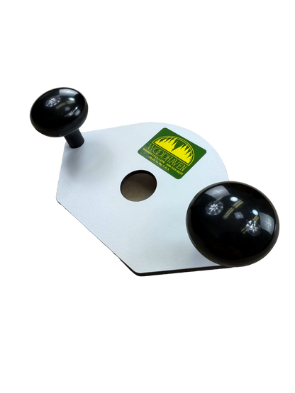 White phenolic base with black knobs and a green label  