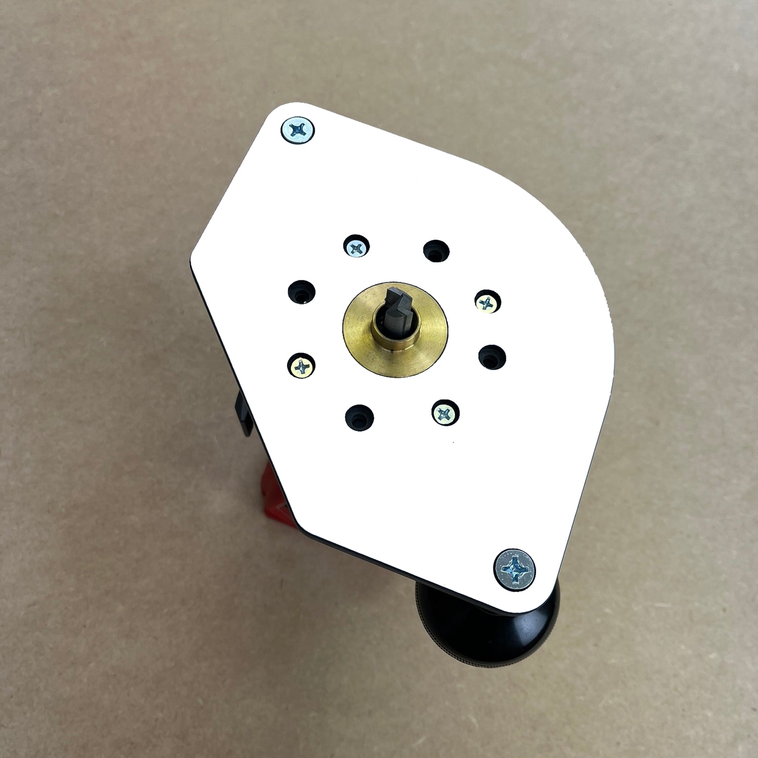 Woodhaven guide bushing base plate for compact routers, front view showing bushing hole