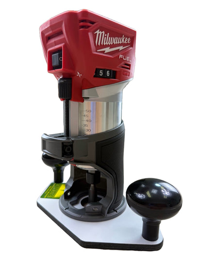 Milwaukee power tool on a white base with control handle