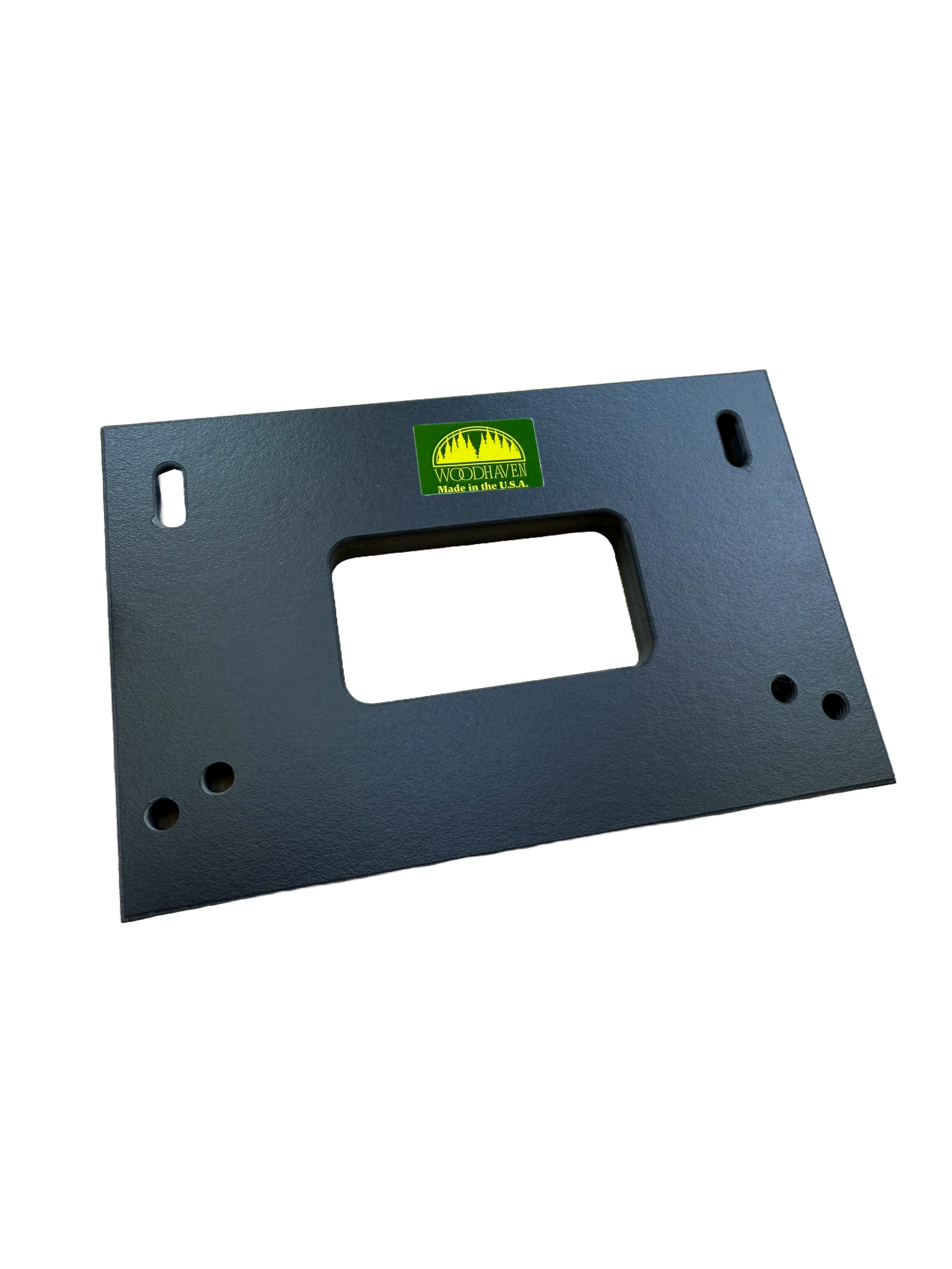 Lockset plate jig positioned on door edge showing template alignment