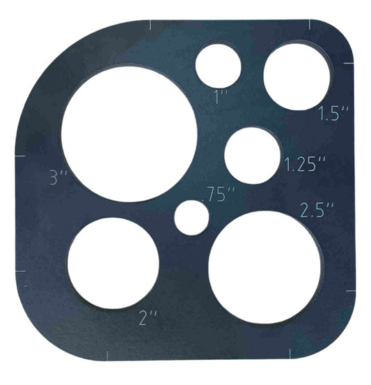 A black phenolic template with various sized circular cut-outs, labeled with measurements.