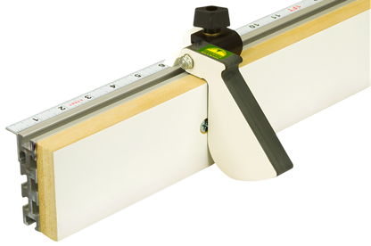 A Woodhaven 4516 3" Curved Flip Stop attached to a white surface, featuring a phenolic stop arm, stainless steel shaft, and ergonomic finger grip.