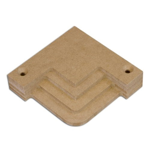 A stack of beige wooden corner templates of varying sizes designed for creating decorative corners in frame and panel woodworking projects.