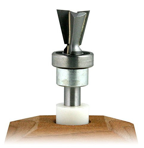 A carbide tipped 14-degree dovetail bit with a bearing on the shank, positioned vertically on a wooden block.